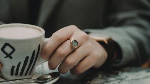 person holding mug